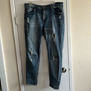 Distressed skinny blue jeans by Refuge. Size 14